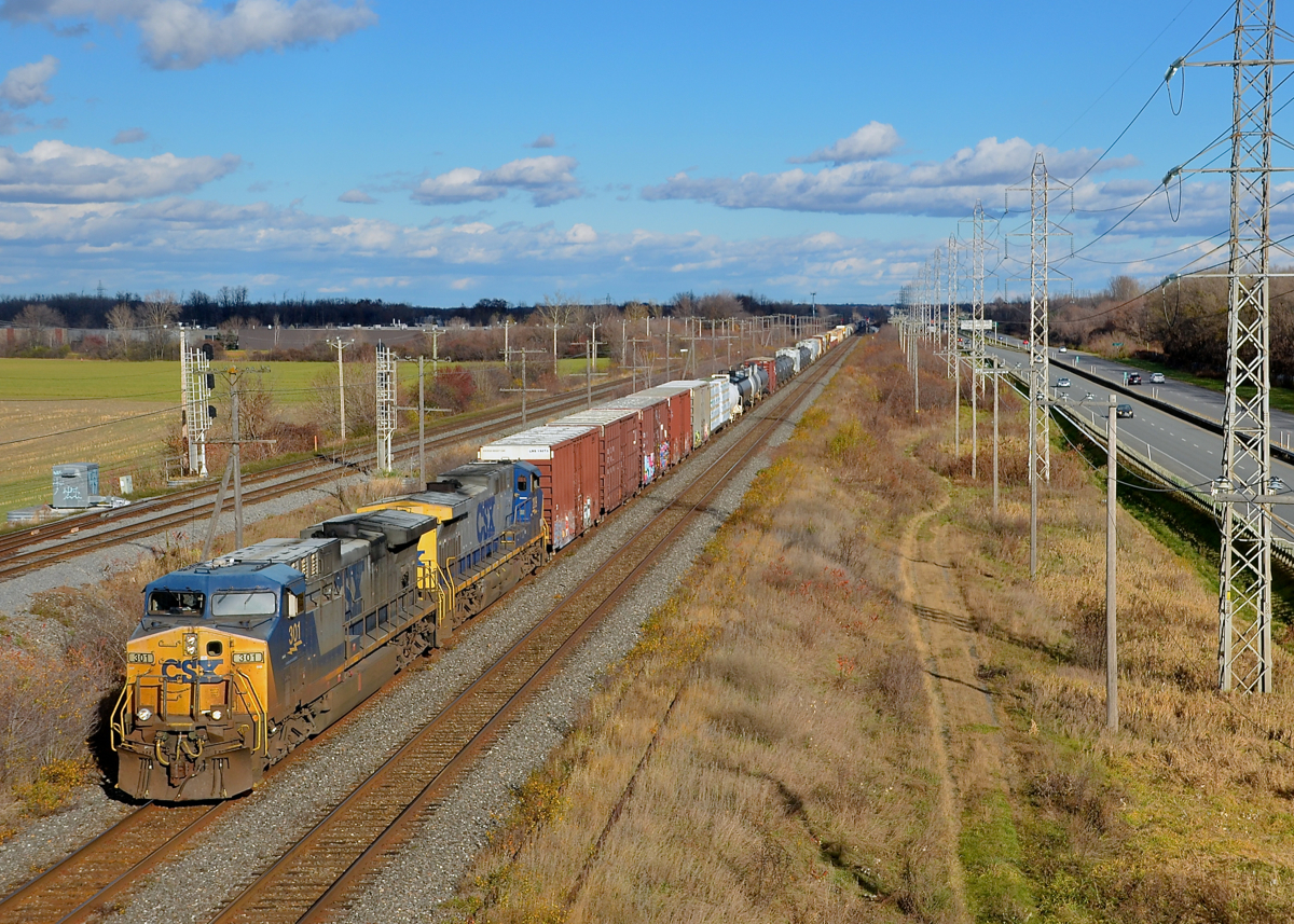 A pair of YN2 AC4400CW's. CN 327 heads west on the CN Kingston sub with CSXT 301 and CSXT 209, both in the YN2 paint scheme.