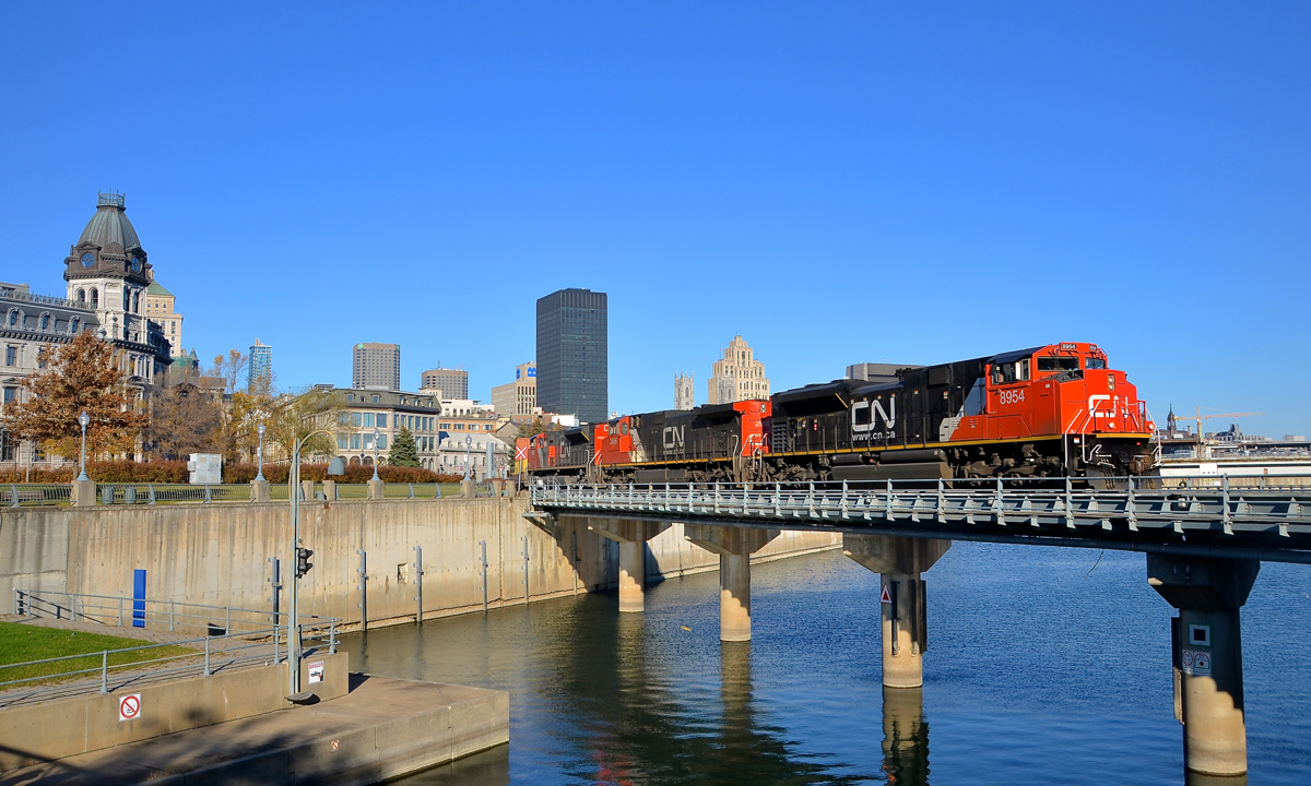 A cleaner than usual SD70M-2 leading. CN 149 is leaving the Port of Montreal with CN 8954, CN 2656 & CN 8883 as power on a completely sunny fall morning. If the leader seems unusually clean, it's because it was washed for its appearance at CN's family day  at Taschereau Yard at the end of September.