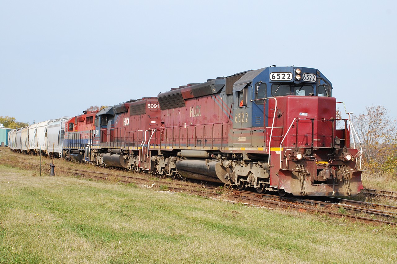 Two of the three Helm SDs that Goderich-Exeter had on lease at the time, assisted by a Rail America unit, have just brought a cut of salt hoppers up from the mine and will soon depart for the trip back to Stratford.