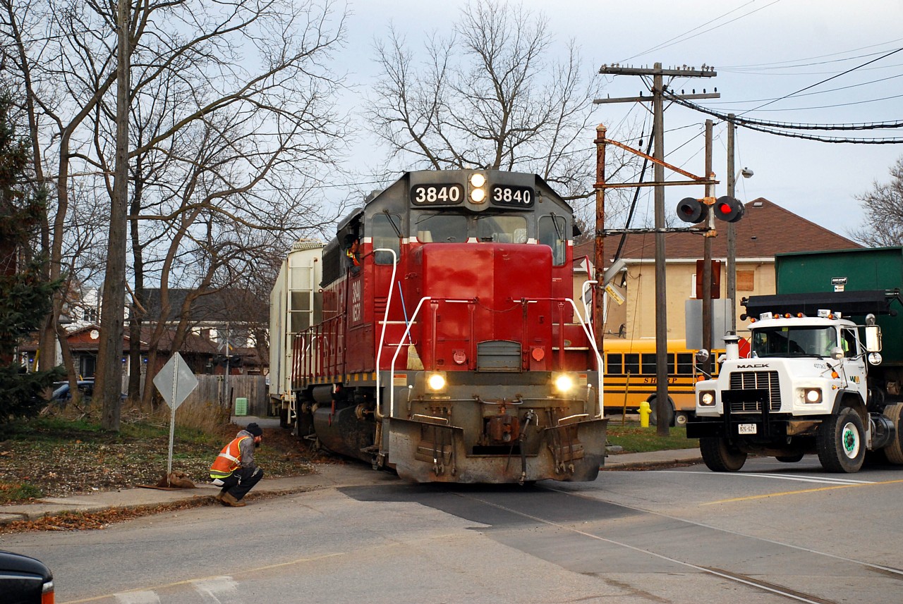 Ingenia Polymers (the owner of the rail spur) had a paving contractor repair the Mohawk Street crossing last week.  They did a great job... so great they even paved in the railway track flangeways.  I guess the crew expected a quality job as they stopped before the crossing.  The conductor watched from the ground and determined that the asphalt was too compacted in the flangeways for the train to proceed.  They ended up backing clear of Cayuga Street to wait for someone to come and clear the flangeways out (the corn broom wasn't going to cut it!)