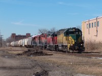 GEXR 432 creeps into Kitchener at the west siding switch of the Kitchener siding on the GEXR Guelph Sub on this fine early spring day. Power is GEXR 4046-GEXR 4019-RLK 2211-RLK 4096 (the latter two still in the RailAmerica scheme). A lot has changed since this was taken. This was even before GEXR began using 6-axle power, and well before GO train service began on the Guelph Sub. And most importantly, King Street at this location was drivable and not torn up for the LRT construction.