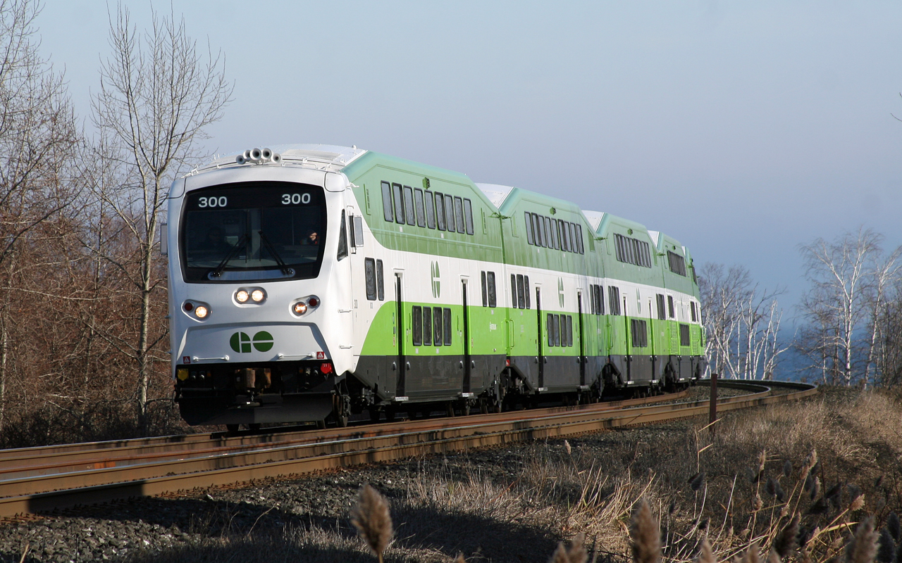 GO 300 leads train 715 up the 1.2% grade out of Rouge Hill and through a scenic curve which brings the tracks along side Lake Ontario.  This is one of the few sets of equipment where all cars are in the new scheme and on the tail end GO 665 was providing the horsepower, which wears the Christmas Themed "Santas Other Ride" wrap
