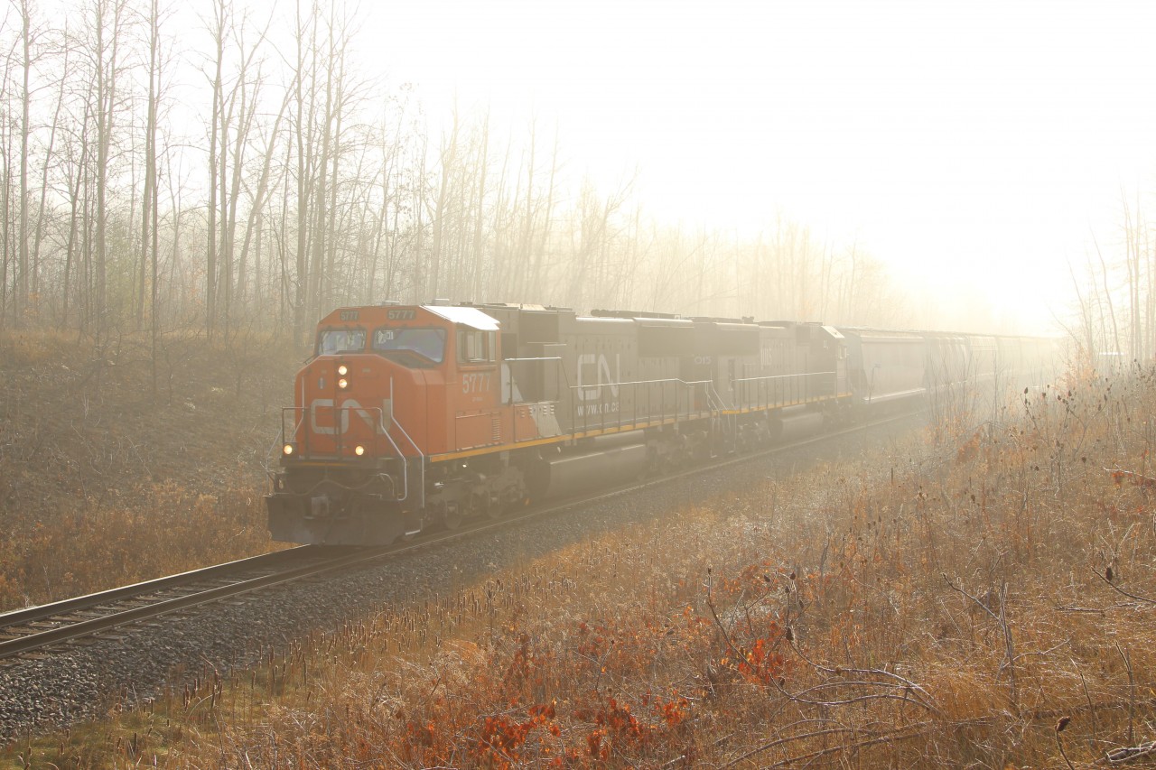 An unusual sight comes out of the fog, no GE power. CN 5777 (GMD-SD 75i) and Illinois Central 1015 (GMD 70) slowly work their way up the hill past MM30 of the Halton Sub. This was good timing, as the fog was lifting quickly and the sun was shining bright just 10 minutes later.