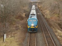 Via Rail 910 coasts down the hill and under the Royal Botanical Gardens walk bridge and up to Old Guelph Road after passing MM 1 of the Dundas sub, awaiting clearance from the work crew at MM 0.6 at Bayview Junction. 