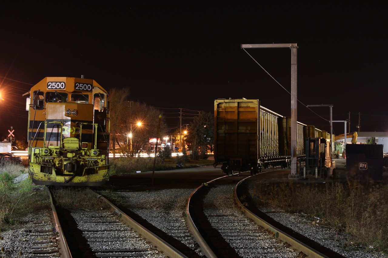 In the early morning hours GEXR local 582 with QGRY GP35 #2500 slumbers away beside a lumber yard in Cambridge. In a few short hours the train will be called on to lift the empty centre beam flats and head to Guelph to lift fresh loads of lumber and anything else destined for the Fergus sub. This train runs daily and interchanges with 580 in Guelph. Thanks to Steve Host for the heads up on this trains schedule.