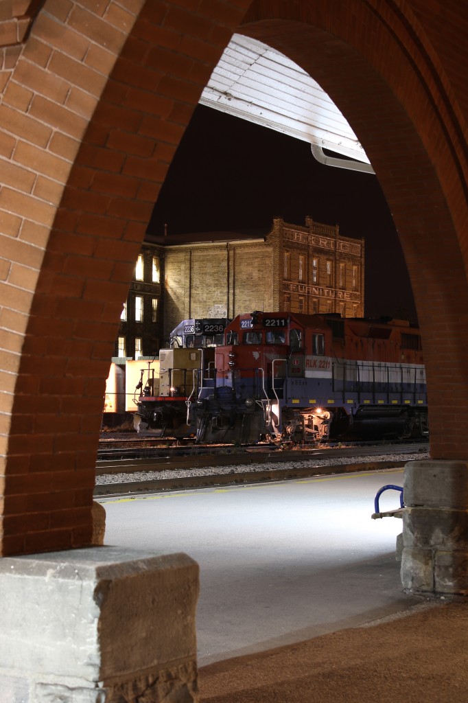 It's hard to make a trip to Kitchener's VIA/GO station without framing something in the building arches. The station and old factory here are very photogenic either day or night. On this night GEXR local 580s power was posing perfectly between the arches with the old Krug furniture factory in the background.