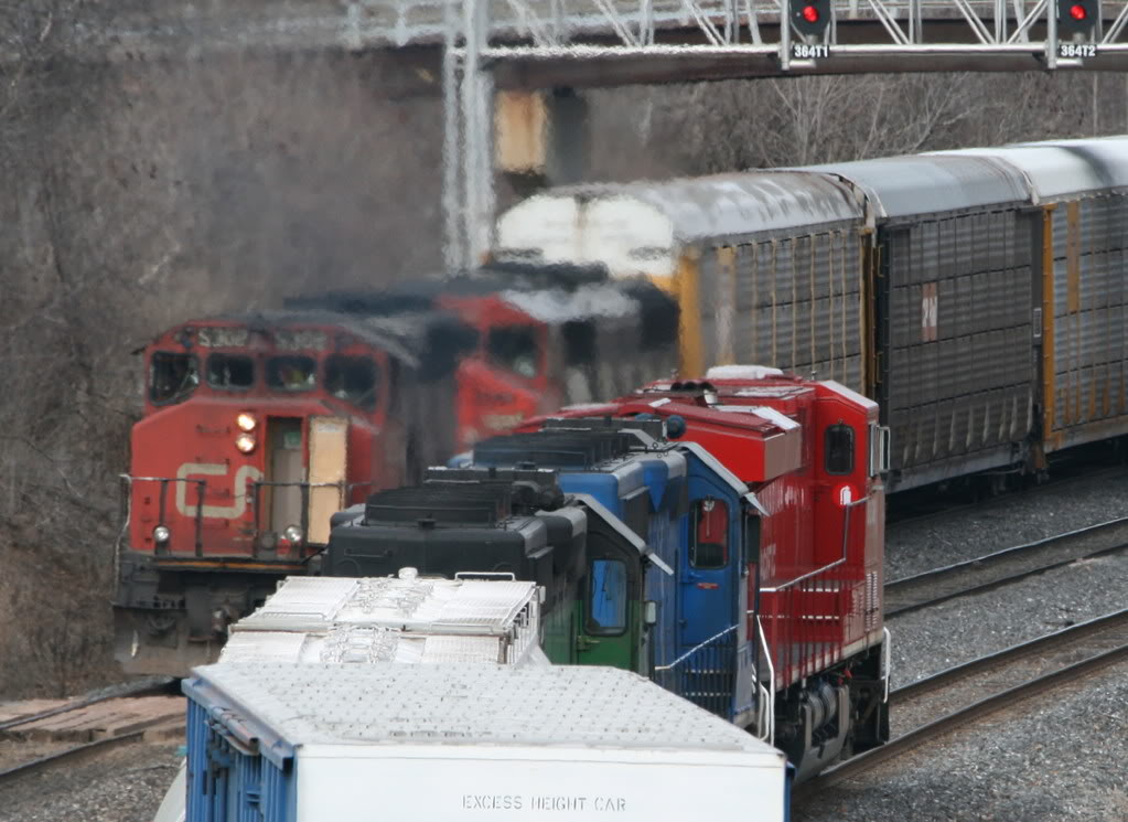 CN 435 doubles out his left at Aldershot while eastbound CP 255 with 2 leasers trailing heads east over the CN