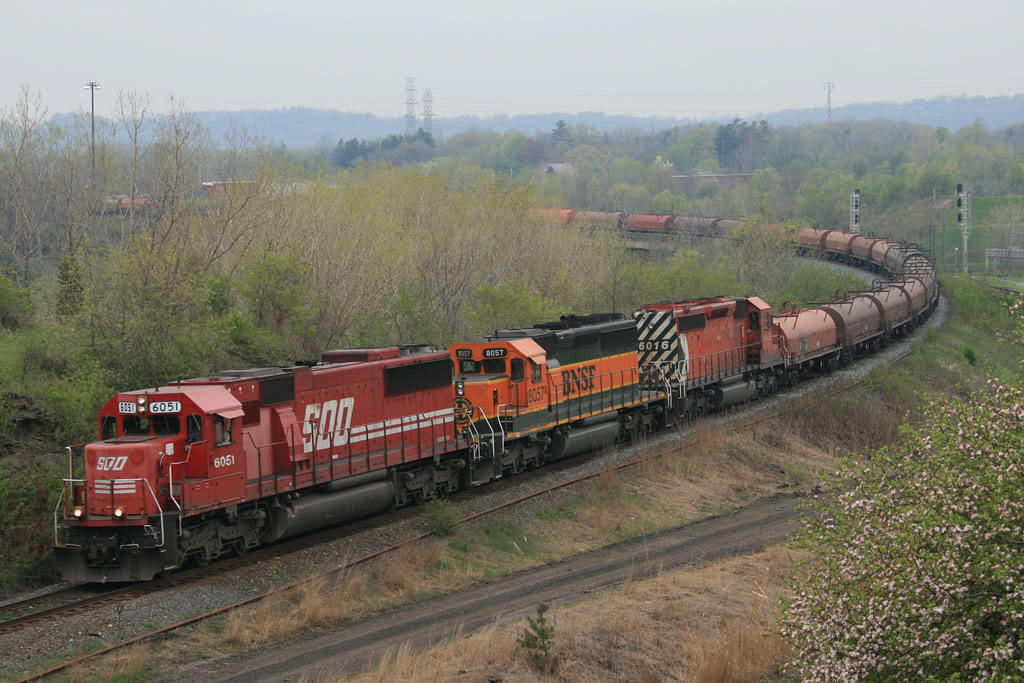 The Steel train negotiates down the Hamilton Sub with SOO 6051- BNSF 8057 (paying back HP hours ) - CP 6016. This combo ping ponged back and forth on this train for some time.
