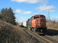 Climbing the dip just east of Georgetown, Ontario, possibly the final CN Q144 roadrailer rushes by on it's way to Mac Yard. A solo SD75I powers this train, which will be missed. 