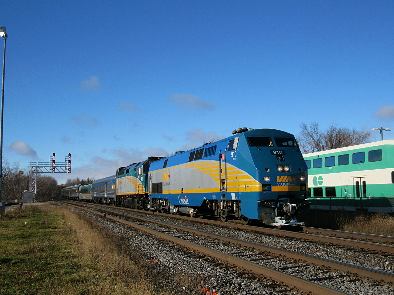 VIA 80 speeds past Georgetown VIA/GO Station on the CN Halton Subdivision after being detoured off the Oakville Sub. 910 and 6456 are up front.