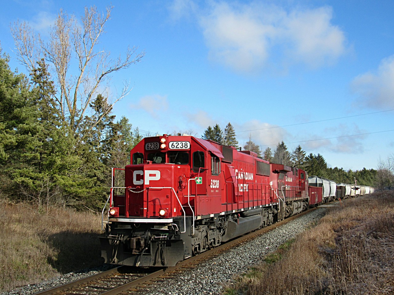 After hearing CP 6238 north on the Hamilton Sub, I knew it was 255. So I prepared for the shot at the Killean mile board at MP 54 Galt Sub. The sun came out just in time too.
