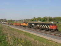 CN 148 with CN-NS-UP combo heads east by Snake Interlocking.