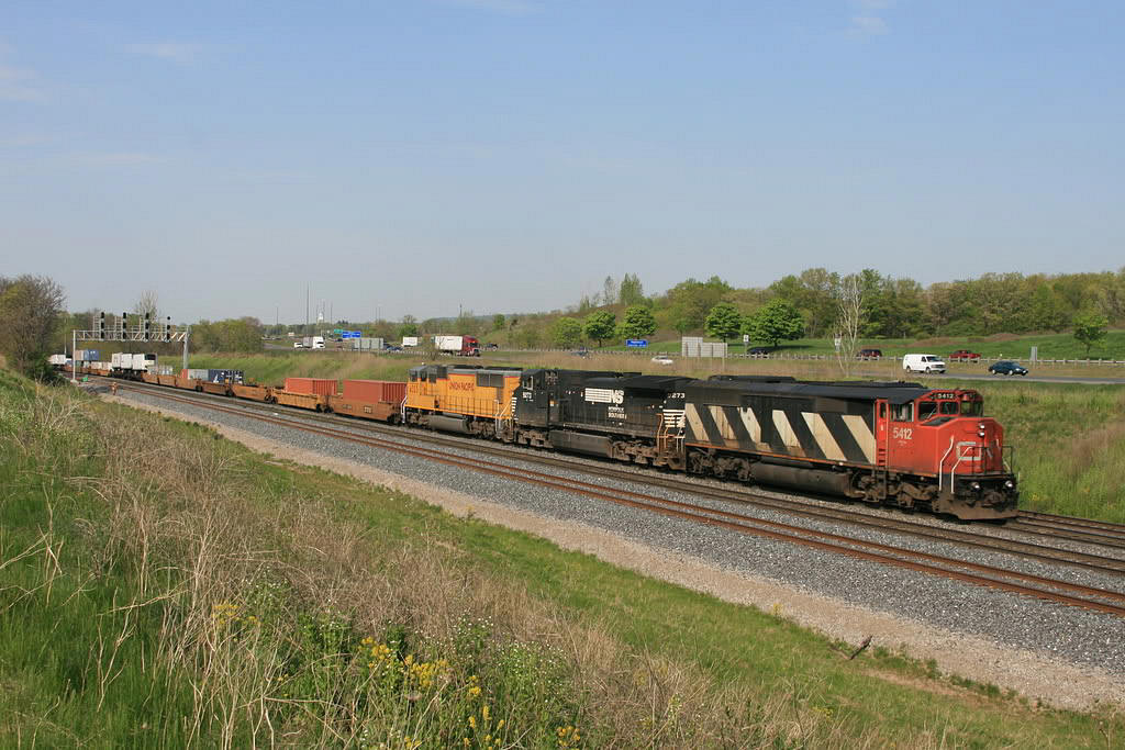 CN 148 with CN-NS-UP combo heads east by Snake Interlocking.