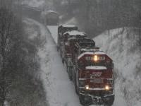 CP 255 climbs the Hamilton Sub during a heavy January snowstorm...a nice red SOO leading...taken from the then new Newman Road overpass looking west