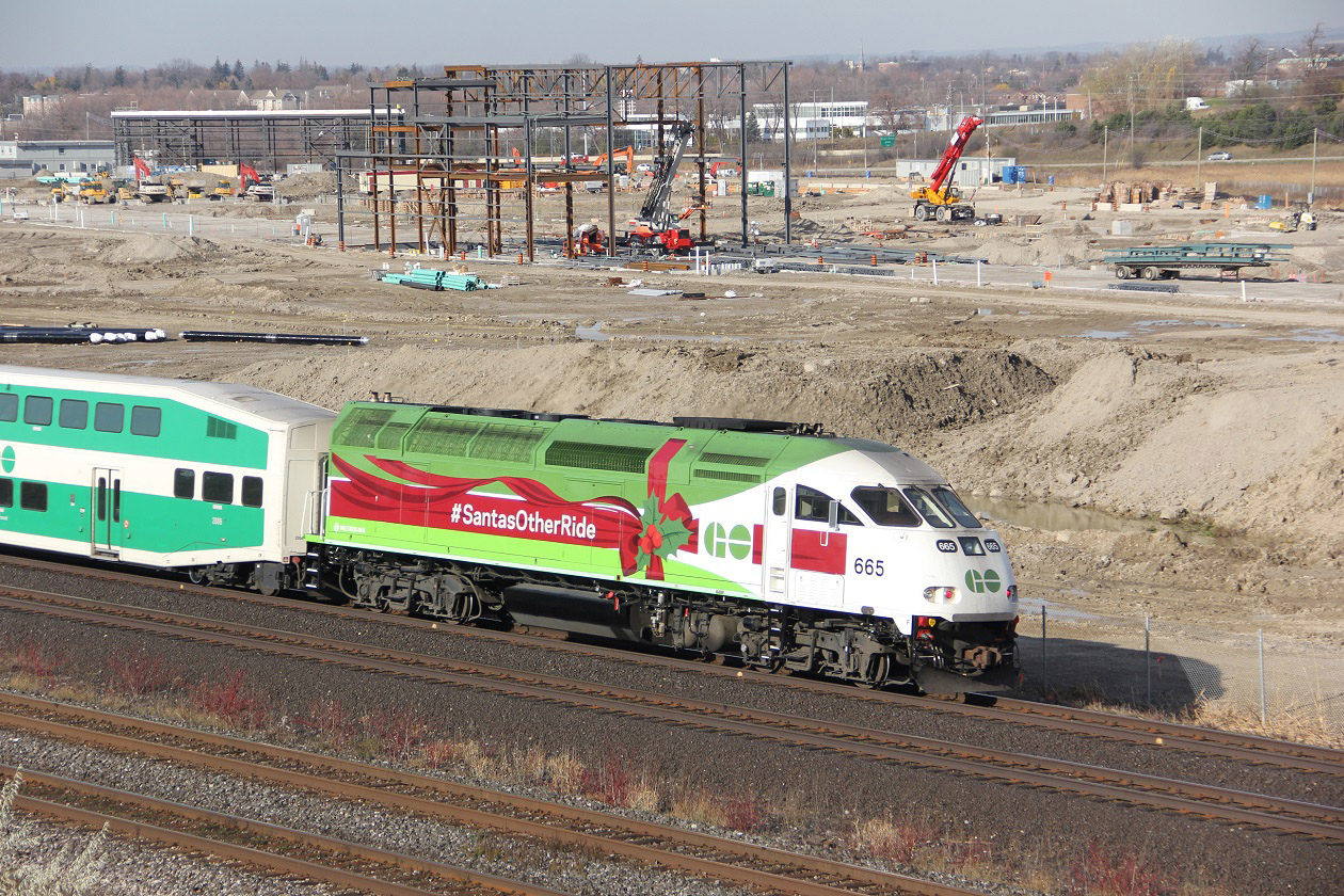 GO transits Christmas 2015 locomotive 665, or Santa,s other ride. Seen here passing what will be Go transits eastern maintenance facility.