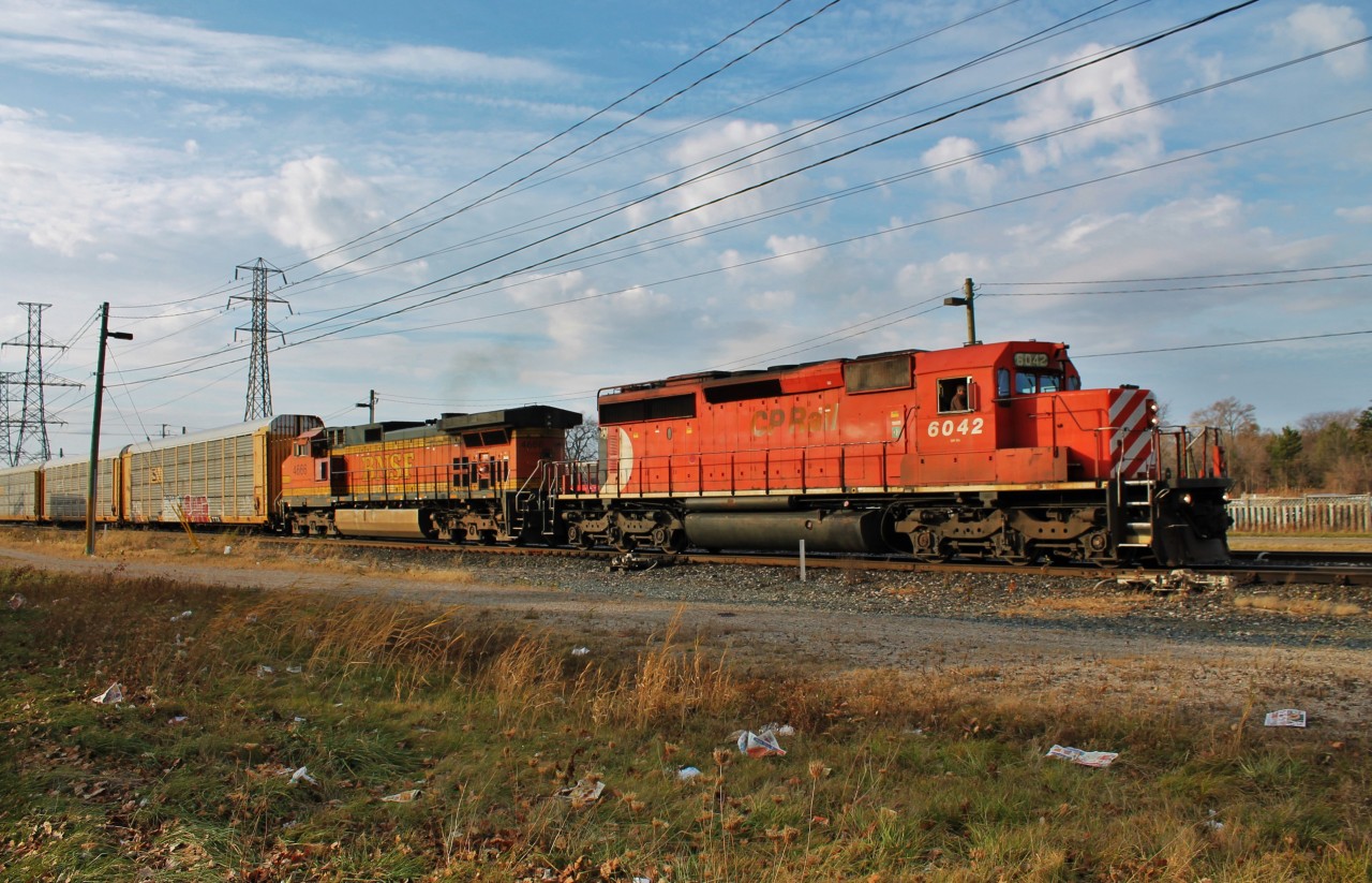 On my way home from school today I saw this pull up to Dougall Ave in Windsor to do a crew change. I went home, grabbed my camera gear and headed back. They let an ETR local into CN's yard first before letting 244 depart. It's always nice seeing veteran power leading foreign units.