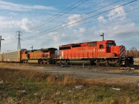 On my way home from school today I saw this pull up to Dougall Ave in Windsor to do a crew change. I went home, grabbed my camera gear and headed back. They let an ETR local into CN's yard first before letting 244 depart. It's always nice seeing veteran power leading foreign units. 