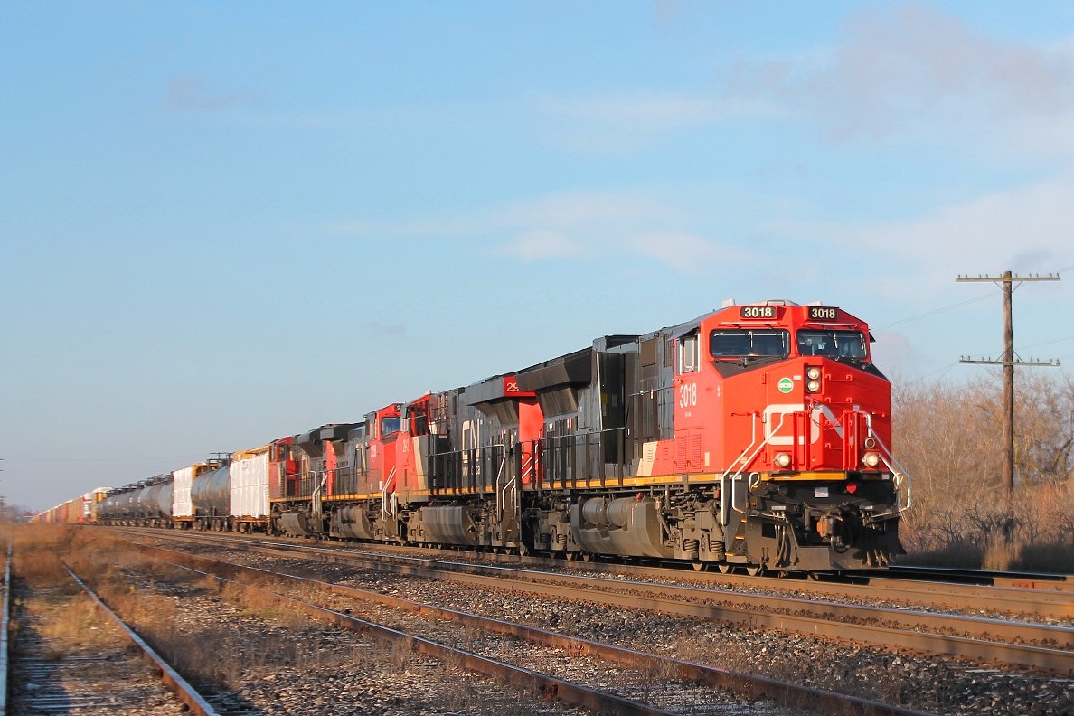 Almost fresh out the box and is it already having problems? The door on the long hood being open! 3018 leads 2942,2558and 8861 east with a long mixed freight.