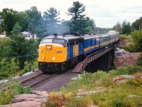 A nice clean looking newly painted VIA 6762 with the Montreal-bound portion of the "Canadian" is seen here eastbound over the Sturgeon River bridge. The 6762 was retired by 1989, and I understand it is currently out of service on the Grand Canyon Railway in Arizona.