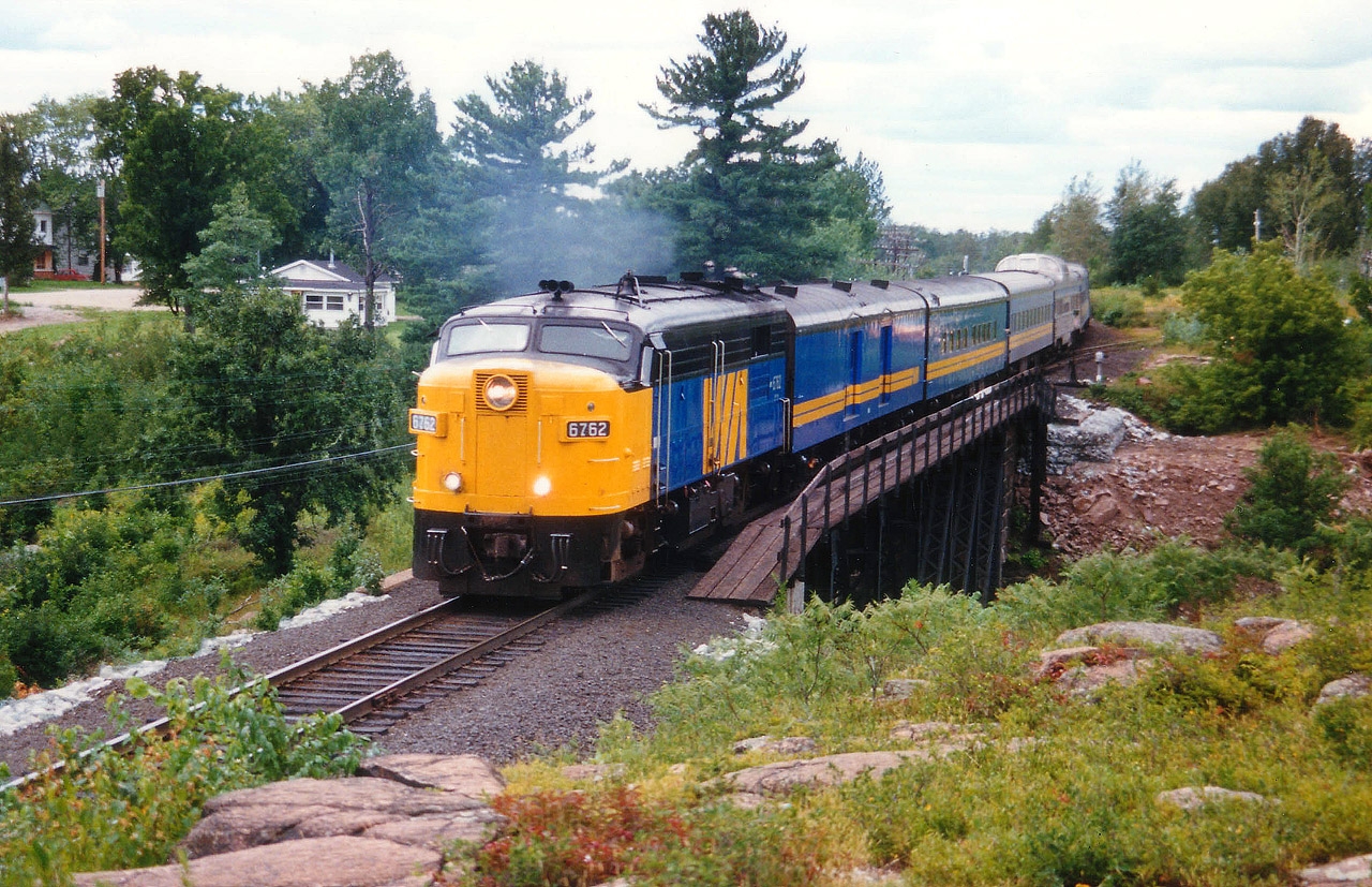 A nice clean looking newly painted VIA 6762 with the Montreal-bound portion of the "Canadian" is seen here eastbound over the Sturgeon River bridge. The 6762 was retired by 1989, and I understand it is currently out of service on the Grand Canyon Railway in Arizona.