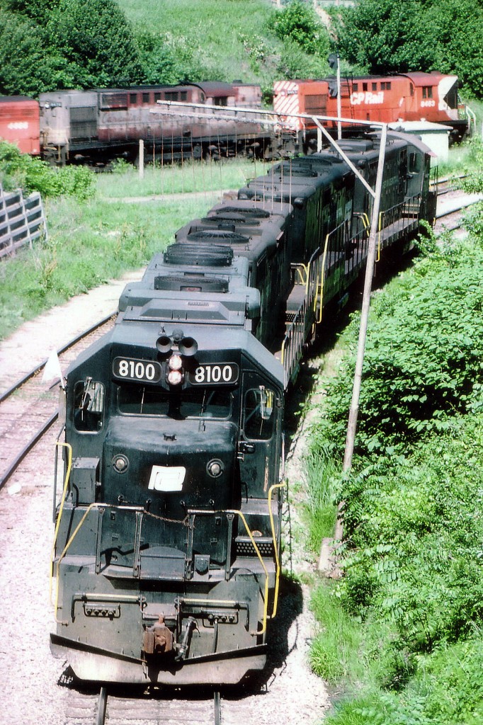 While waiting for the late afternoon TH&B "Starlite" to be put together for the run back to Toronto, I wandered over to Chatham St to see what was going on. Off the Dundurn St bridge at the wye I had a quick opportunity to catch "all" the action in one image. In the foreground is a quartet of GPs, rear one looks to be a 7 and the middle two are B units, with cabs removed. In the background is the power off the Goderich turn, also moving on the wye. That set consists of CP 8483, 8476 and 4466. Power for Starlite is PC 8100, 3800, 3819 and 5829; with the 8100 as leader when the train finally headed out near sunset .