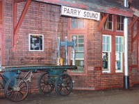 As with the irrepressible Young Mr. Host, I hereby submit image number 500 to the RP.ca site.:o) Sure, it is only a station view, but it holds many memories. I had showed up for the northbound Canadian, and agent Jimmie Bell was such the gracious host that I ended up once again yakking with him well after dark. A southbound with CP 6022 leading was 5 minutes out; it was the eastbound Toronto section of the Canadian VERY late, and I decided to wander out and shoot a night image while waiting to see what other power would be on the train. (CP 6022, VIA 6636,6622; so the VIA leader had crapped out somewhere) Although in 1986 this scene was commonplace (that is, if you could find a station), now it looks like a front in a museum. The only 'modern' improvement was the replacement of the old chalkboard announcing train times. You can see the outline on that cheap, phoney railroad "brick". The station, having been empty for a number of years after the agent was pulled, survived vagrants and druggies and eventually began life anew as an Art Gallery and Gift Shop. (Incidentally, initially I was going to call it quits after 400 submissions to this site but it is like trying to quit trainwatching. It just doesn't happen)