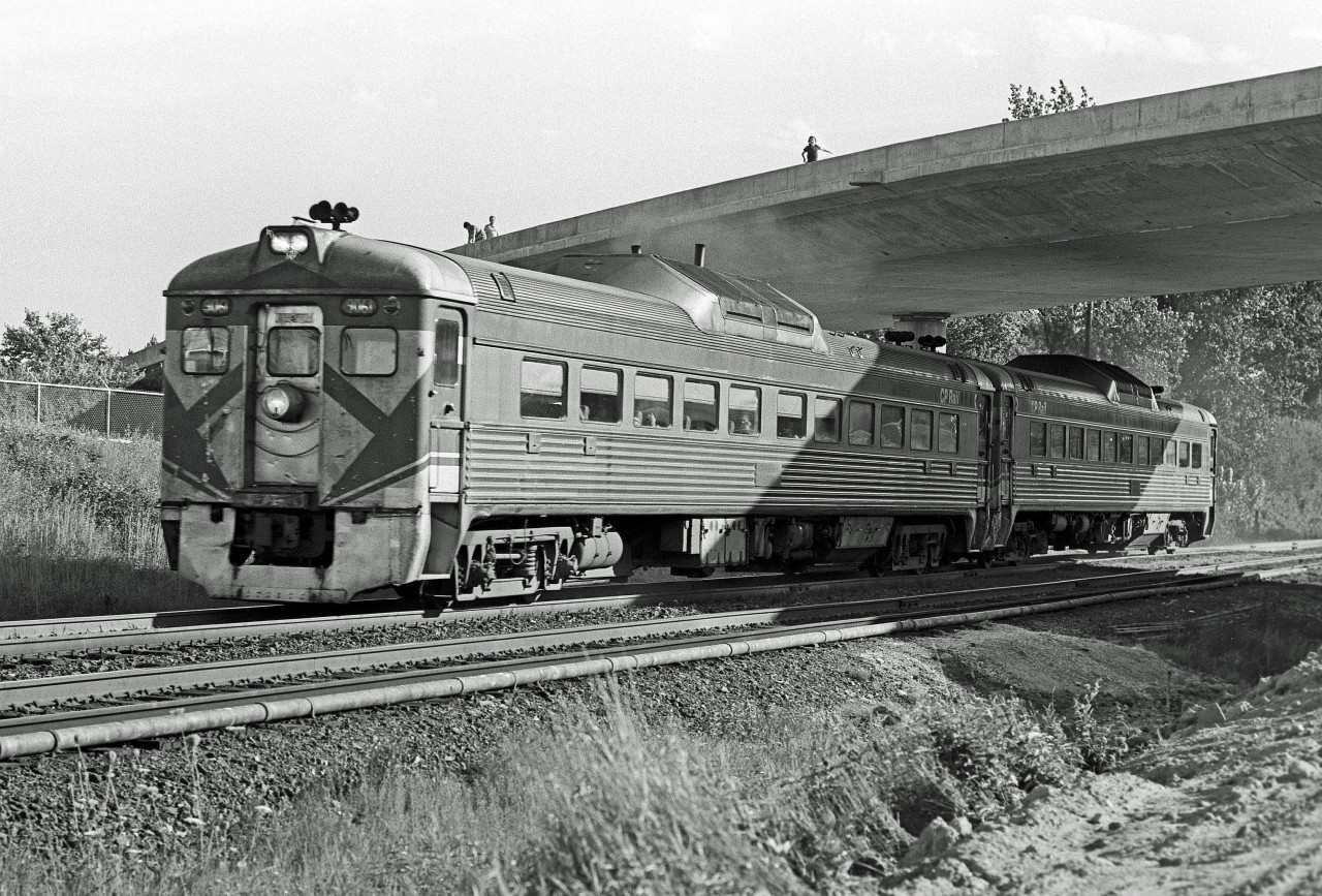 The Pharmacy Avenue bridge in Scarborough is still under construction as two RDC's pass underneath.  The lack of handrails didn't prevent a few trespassers from exploring. Circa 1976. 


The early evening consist is shown eastbound enroute to Peterborough / Havelock.  In the mornings, the inbound train to Union Station would pass by my house at 8:32 AM.  If I got ready in time for school, I'd try and watch it pass by... it was always a great way to start my day!