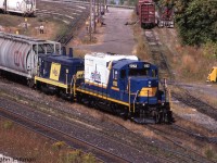 GP9u RLK 1752 and cabless switcher 1200, both in clean paint, are switching cars in Stuart Street Yard, Hamilton ON. <br>
