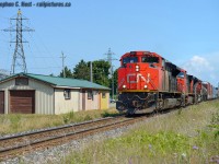 Arnold's great photo of the now demolished <a href=http://www.railpictures.ca/?attachment_id=21889 target=_blank>Beamsville Station in 1975</a> has compelled me to quickly pull this out and post it - Beamsville is where my parents now live and we were at the nearby Grocery Concern to grab a few items to complete my dish for our upcoming family dinner. I knew 422 was close so walked to the station for a photo, and this is what you see now. I highly doubt any of this structure uses the original station but wierder things have happened. Could even be an old express shed clad in aluminum siding typical of what they installed in the late 80's. and yes I'm basically saying this is the site of the old station, or within dozen(s) of feet of this structure at the least. Since I moved to the area in '01 I don't know the history.. please feel free to comment below if you have any memories to share.



