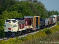 In response to <a href=http://www.railpictures.ca/?attachment_id=21626 target=_blank>Glenn Courtney's great photo</a> Former VIA 6305, now OSR 6508 leads the westbound Woodstock turn with a healthy cut of mixed freight traffic out of Woodstock. Oh, and that sound - a pair of  EMD 567's groaning in unison as the crew accelerates to 25 MPH track speed. For many of us, this is a real treat, and always a great show put on by the folks at Salford. Is this the golden age of shortlines for 'round here? Sure seems like it!
