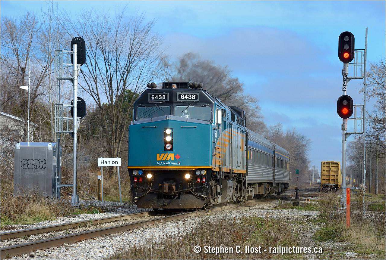 Hanlon is the name of the new control point for the Guelph N Spur and CTC is turned on - effective 0001 November 15 the entire line from Silver to London is CTC Controlled, with one small exception. Due to the King St underpass project (part of the ION LRT construction in Waterloo) a small segment in Kitchener remains OCS and should remain so for a year or so until the shoo-fly is removed.
What does this mean for railfans? First of all, signals are approach lit, which means you won't see a signal until the train is by the previous control point. However, control points are 10+ miles apart so they are lit far far in advance despite block signals every couple of miles. Also the old station name signs no longer apply, as far as I can tell the crews call approach signals and control points, but not block signals
Who paid for it? To end any confusion, this was 100% paid for by VIA Rail, a $25 million project which included signalling, bonding of rails, codeline, radio installations, switch heaters, power switches, some rail improvements and  according to VIA , fencing (haven't seen any. have you?). $25 million really won't go too far on a 90 mile long railway... Railterm in Dorval continues to dispatch the line.
Why would VIA pay for it? Good question, but it probably had something to do with the fact this was the busiest dark territory, mixed freight and passenger railway in the country hosting no less than 20 to 24 movements a day (locals included). This was long in the works, before GO was in the picture. Watch for that fencing, it may still be yet to come, obliterating a photo location permanently.
