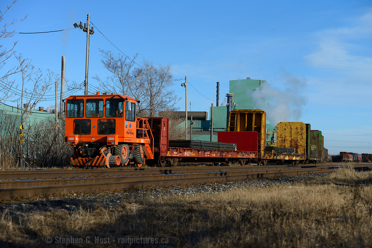 A photo that would make Rail King proud  with about 20 loaded cars in tow, this Trackmobile is shoving to the rear at a measly 1 or 2 MPH....... sloooooooooooooooooooooooooooooooow. Now, CN SW1200 7304 roams these rails eliminating the need for the Rail King, for now. 

This was one of my first attempts to find 7304 since it was on the property in mid 2014... but I found this instead and decided may as well document it before it's gone. Not exactly something railfans like to document.. what do you think? Are trackmobiles your thing or no?
