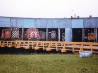 I have forgotten just exactly where the Sudbury roundhouse stood. All I can recall is it wasn't far from the Doran's Brewery:o)  Went back up that way some years back and the roundhouse was gone. Someone on the list will pinpoint its' location, I am sure of that. This view taken 30 years ago as of this posting shows it a rather busy place. Assortment of CP power as well as a couple of Budds inside. Somehow in the back of my mind I think I heard the building was destroyed by fire. Anyone? When??  Thanks in advance, as always...............