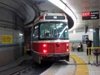 Tight curves and lots of squealing: Toronto Transit Commission CLRV 4131 sits at the loading area of the TTC's underground Union Station streetcar loop after having dropped off a load of passengers (including the photographer) on a southbound 510 Spadina run. The overhead pole is stretched to the extreme, and the yellow line on the platform warns passengers to stay clear of the rear and front overhang swing. The Union Station loop opened in 1990 long after all the surrounding buildings were built, and as a result was shoehorned in with this tight loop to curve around the large underground pillars below Union Station.

