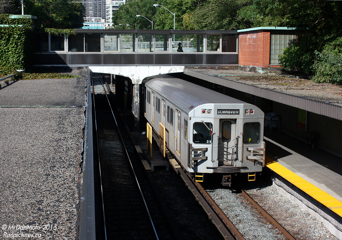 On a sunny early fall day, a set of Toronto Transit Commission T1 subway cars departs northbound from Rosedale Subway Station along the open section of the Yonge line, with car 5344 trailing. Built by Bombardier in 1996-2001, they were initially all assigned the Yonge-University-Spadina line out of Wilson Yard (and Davisville). Earlier deliveries were later moved to the Bloor-Danforth in the early 2000's to displace older H2 and H4 cars. New Bombardier Toronto Rocket deliveries starting in 2011 not only retired the last of the H-series cars, but eventually displaced that large remaining group of T1's (5136-5371) from the YUS to the BD line, which is now fully operated by T1's.