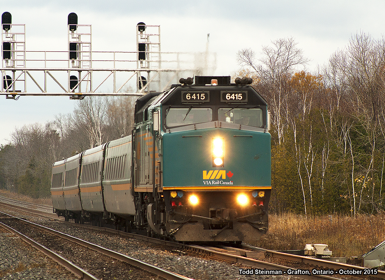 A few years back, CN started a project of triple tracking their mainline between Napanee and Belleville, as well as adding a third track between Grafton and Cobourg. Here we find VIA 6415 with train 64 approaching Station Road at Grafton, flying underneath the signals as it continues east for Belleville.