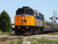 VIA 6427 flies across Main Street in Lynden, leading it's four car consist to it's next station stop at Brantford. Note how this engine was modified...most distinguishing is the addition of the third headlight. My first sighting of this paint scheme on 6427 was 1989 - I departed a train at Napanee and saw not only was the new motive power for VIA Rail at that time, but this paint scheme as well. Although this paint scheme was modified through the years, 6427 was finally repainted to the current design. I didn't realize it at the time, but I photographed 6427 only this past weekend (Oct. 31st 2015) in Port Hope: <a href="http://www.railpictures.ca/?attachment_id=21408#sthash.c9mx3wOl.dpuf"> http://www.railpictures.ca/?attachment_id=21408#sthash.c9mx3wOl.dpuf</a> A transformation indeed.