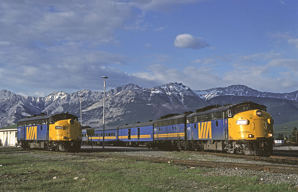 Via Rail FP9A 6305 sits at the head end of #3 during its station stop in Jasper. Via 6313 sits on an adjacent track, it came into Jasper from Prince Rupert with the Skeena. It would be added to #3 behind 6305 and make the trip to Vancouver for maintenance.  

I'm not sure if at the time I realized how lucky I was to take in scenes like this in Jasper. These were the final days for F units on Via in western Canada as the F40PH would soon take over. And I sure didn't think that 28 years later 6305 would be hauling freight in southern Ontario!