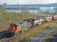 CN 2121 and BCOL 4602 lead train 331 uphill out of Hamilton with steel coil cars on the head end.  They are swinging west on the connecting track (aka Cowpath) and have a red over green signal to enter the Dundas sub.