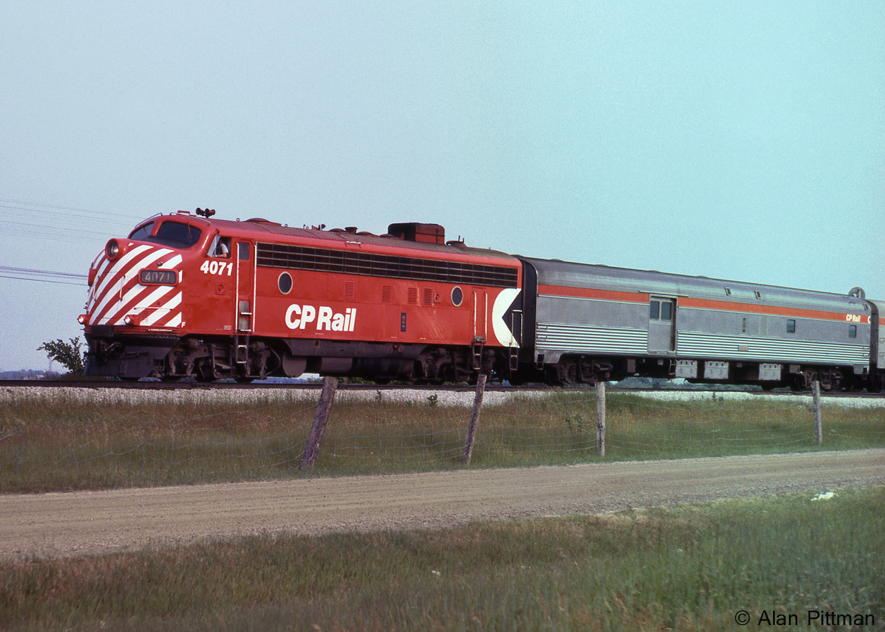 CP train 11, the Toronto section of "The Canadian" heads north on the Mactier sub main in Vaughan. FP7A CP 4071 is leading, a single FP7A in this number range being typical power on this train at the time. Train 11 will meet Train 1, the Montreal section of the westbound "Canadian", at CP Sudbury station. 
Just ahead is the signal and power-operated switch at the north end of "Elder" passing siding. 
Just over 4 months after this picture, on October 29 1978 VIA assumed responsibility for CP's passenger rail services. An early casualty was the Toronto section of the Canadian, CP trains 11 and 12. 
VIA's 1979 timetable shows their rationalized transcontinental passenger service, with the "Canadian" trains 1 and 2 running between Montreal and Vancouver, while "Super Continental" trains 3 and 4 ran between Toronto and Vancouver.  Winnipeg was one station that both trains used - therefore the recommended place to change between trains.