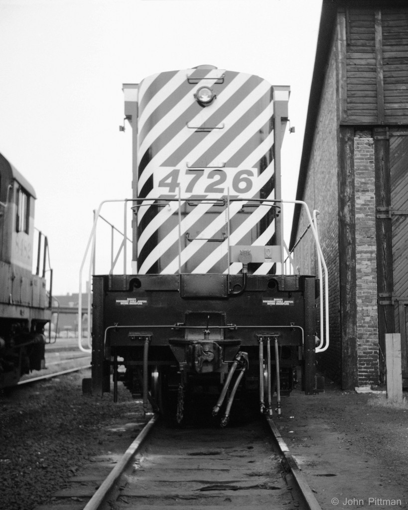 On the occasion of my one and only visit and guided tour inside the Trois Rivieres roundhouse and engine facilities, I obtained this rare back view of factory fresh M636 CP 4726.  
Remember ....  Disconnect cable jumpers before uncoupling   
To the left is RS-10 CP 8482.  A corner of the roundhouse and a locomotive-sized door are to the right.