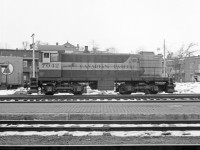 Winter of 1970-71.  Venerable ALCO S-2 switcher CP 7042, is working Trois-Rivieres yard, where it was regularly assigned. My source indicates it was built by ALCO Schenectady in 1946, so it was then about 24 years old. The ALCO cast metal manufacturers plate is on the bottom right of the cab, above the cast CP class DS-10d plate. <br>
I was the only visible railfan in T-R the two years we lived there.  The engineer seems be looking in my direction, hope I didn't annoy him. <br>  
Camera was a Yashica Mat twin lens reflex. Best suited for slow or stationary subjects, as the ground glass viewfinder reversed everything. 