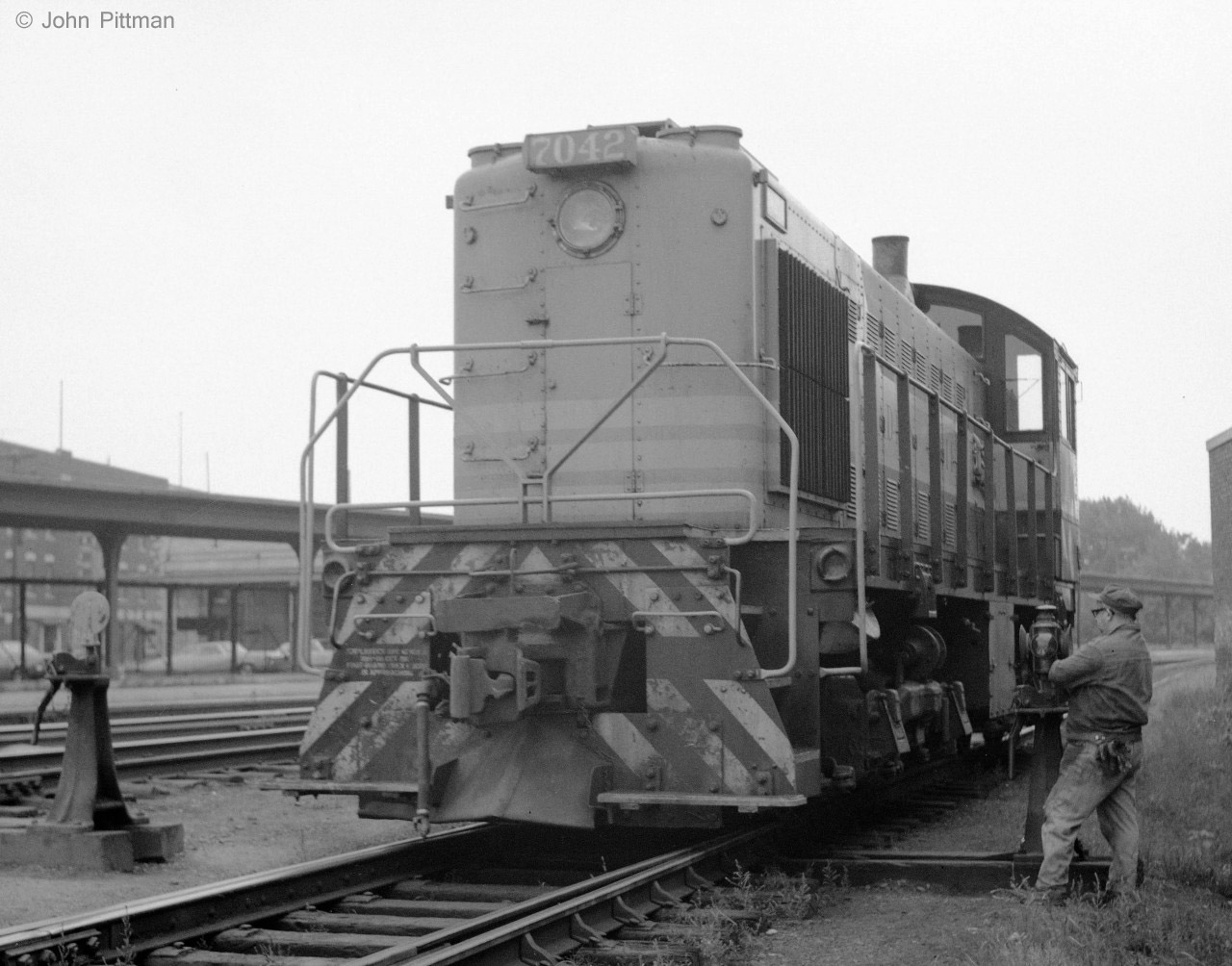 ALCO S-2 switcher CP 7042, is en route between its parking track beside the roundhouse, and a flat switching job in Trois-Rivieres yard, where it was regularly assigned. My source indicates it was built by ALCO Schenectady in 1946, so it was then about 24 years old.
I don't ever recall multiple switchers working together at T-R in 1970-71.  The absence of MU socket and related brake hoses in this S-2 picture is one very good reason ! 

I was the only visible railfan around T-R station and yard for the two years we lived there. The local railroaders may have been puzzled by my activities, but were quite tolerant. I didn't push my luck too far, I guess.