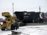 Last move of the shift for the midnight engine attendants was to turn the sand car and dayshift would spot it at the sand towers for unloading, but a series of events lead the car to slowly roll off the turntable. Upon investigation the employees where cleared of any mistakes and no actions taken against them. Here the truck is being removed so a hi rail crane can lift the car.