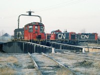 A heavy frost on a cool refreshing morning. CN  1204 has just come out of the Rectory street roundhouse and rides the table for  service { fuel and sand } then its morning assignment.