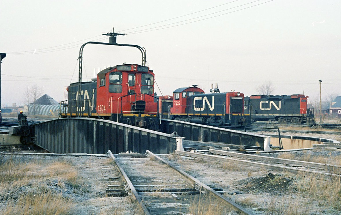 A heavy frost on a cool refreshing morning. CN  1204 has just come out of the Rectory street roundhouse and rides the table for  service { fuel and sand } then its morning assignment.
