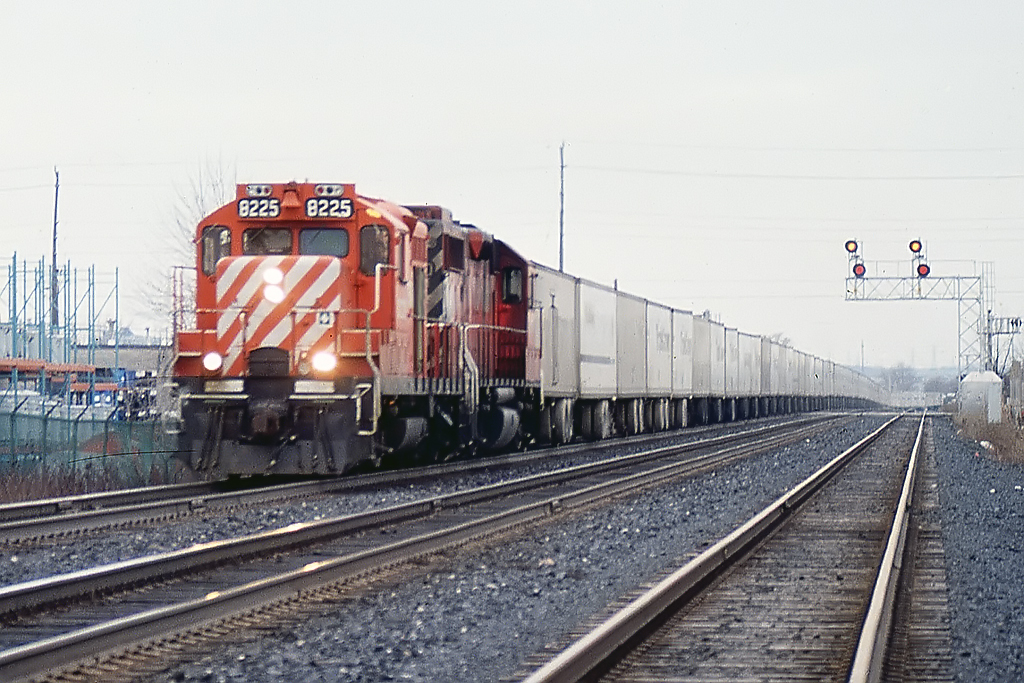 BAck when CP had the roadrailers, a huge string follows 8225 and an unknown GP38.