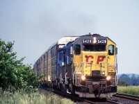 With no red to be seen, 3 EMD's heads west from the Hornby Dip