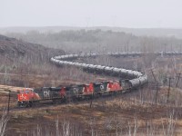 A four unit lashup including an SD70ACe eases a loaded crude oil train through Sudbury's first real snowfall. Power consisted of CN 2884, CN 2134, CN 8103 and CN 5647.