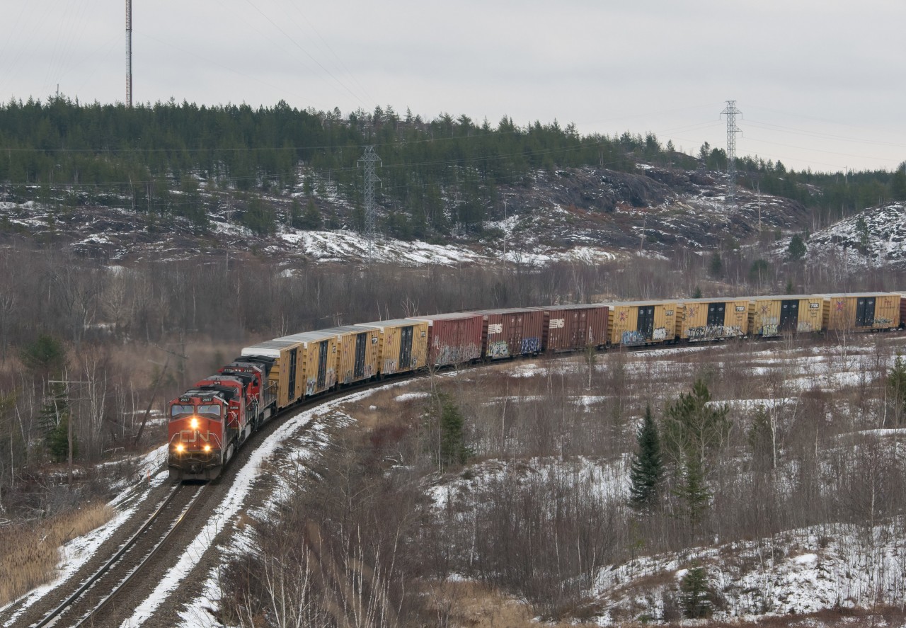 IC 2697, IC 2458 and CN 2130 haul their train northward on a mild November day.